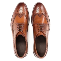 Klassieke bruine brogues met een rozetdecoratie